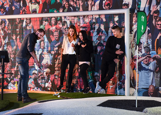 Play the golf ball over a large football