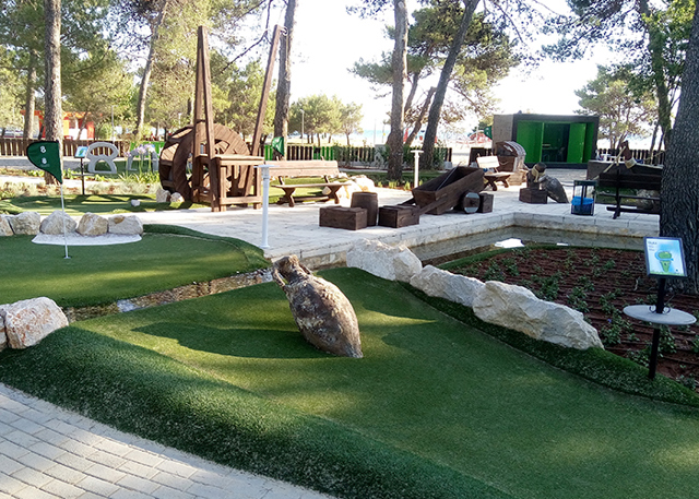 Jump over water in Zaton Adventure Golf