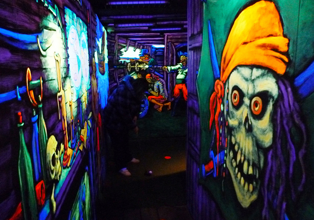 Blacklight paintings inside the pirate ship