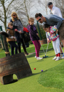Man and child playing Adventure Golf