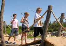 Bridge with children walking over it at adventure golf