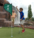 Happy boy playing Adventure Golf