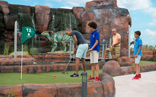 Family playing Adventure Golf at Jurassic Golf in Netherlands