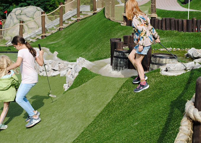 Kids playing adventure golf