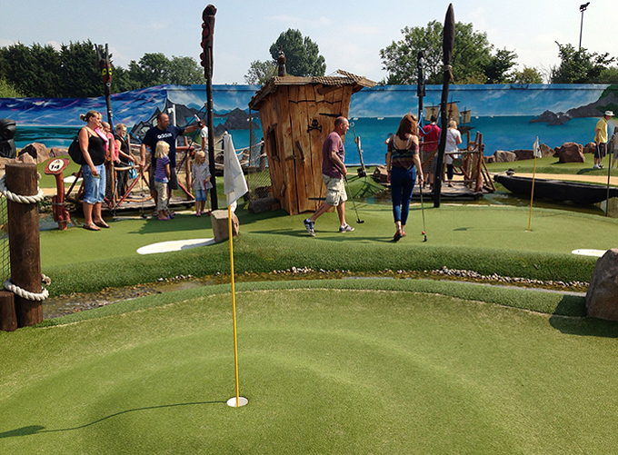 Playing golf at Pirate Bay Adventure Golf