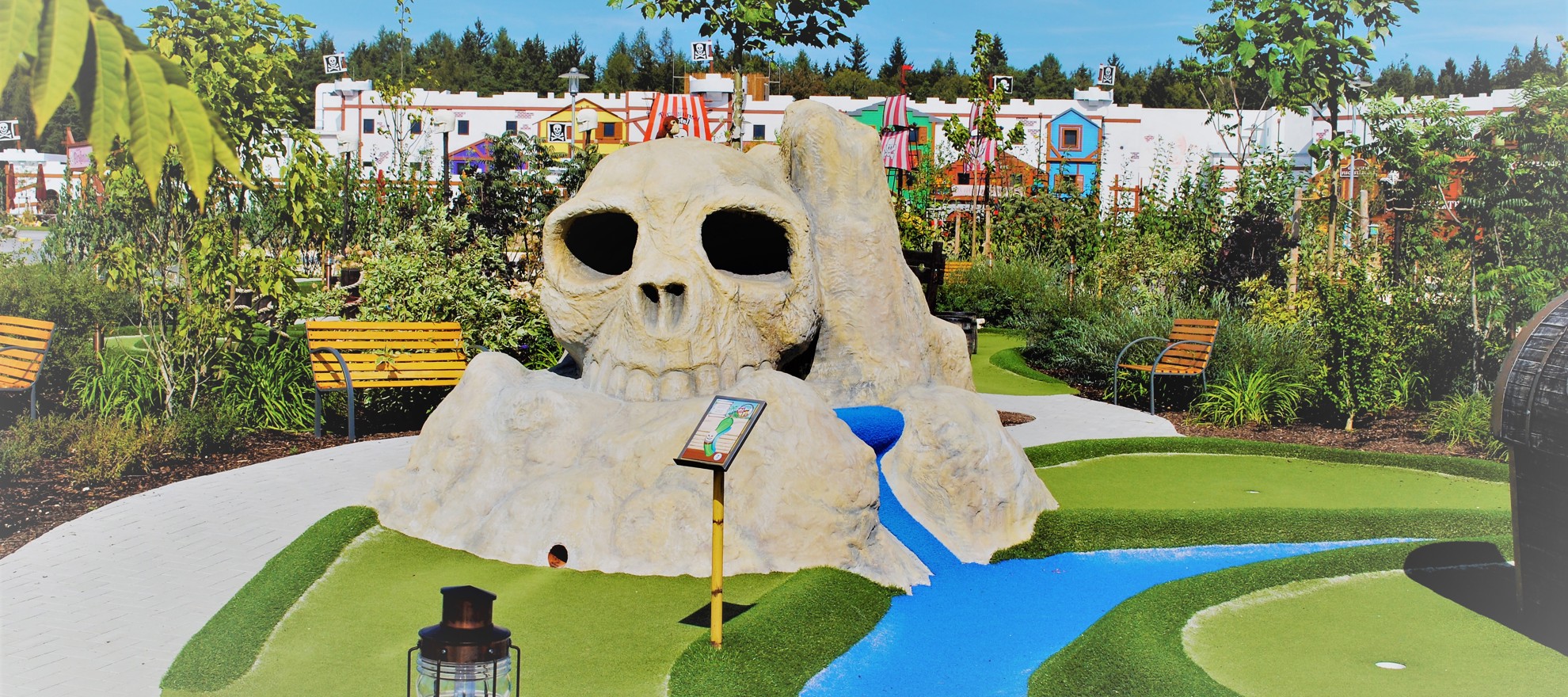 View of the Pirate Adventure Golf course at the LEGOLAND Holiday Village with the 142-room Pirate Island hotel in the background.
